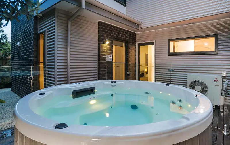 Large outdoor spa bath at Sea View: Luxury Beachfront Torquay holiday rental. 
