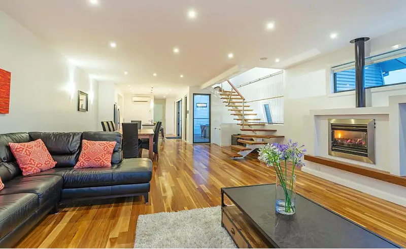 Open plan living area with staircase at Sea View: Luxury Beachfront accommodation in Torquay Vic.