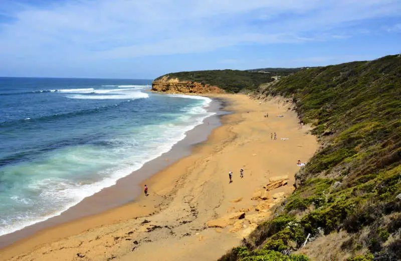 People on the beach at Bells Beach in Victoria.