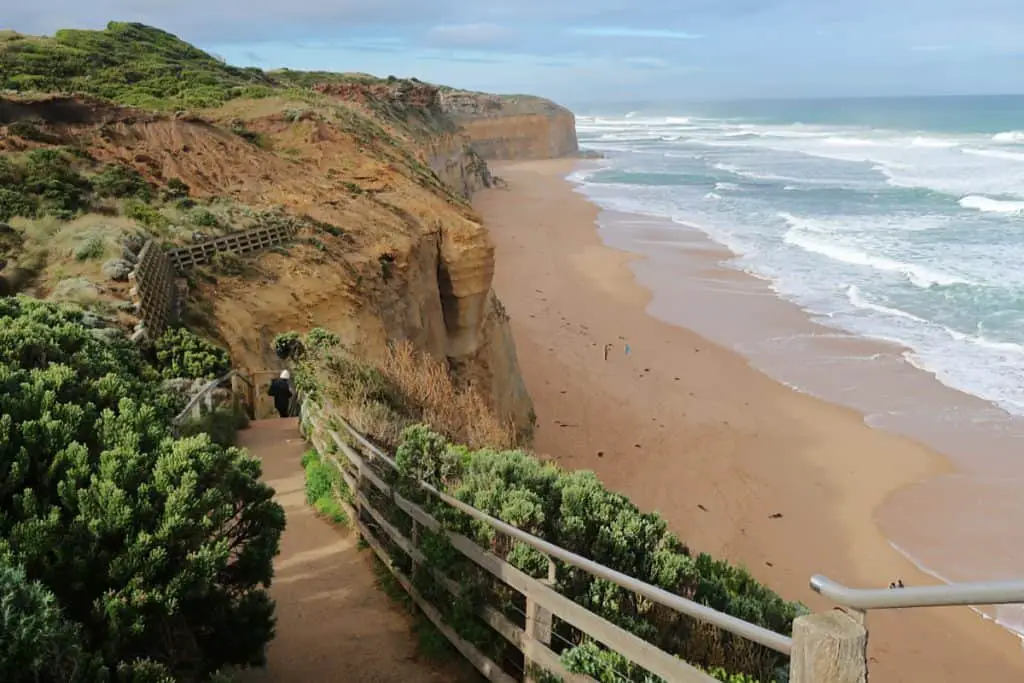 Gibson Steps Beach one of the beautiful Great Ocean Road Beaches. View of the beach and person climbing down the steps.