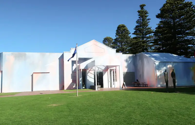 The colourful Warrnambool Art Gallery entrance with a large expanse of grass. A must-visit tourist attraction in Warrnambool for lovers of art.