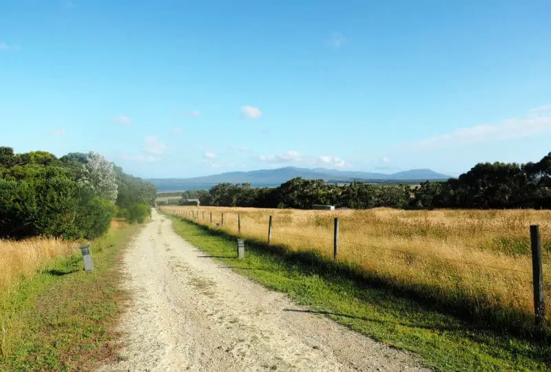 Dirt road and farmlands at Wilsons Prom Victoria.