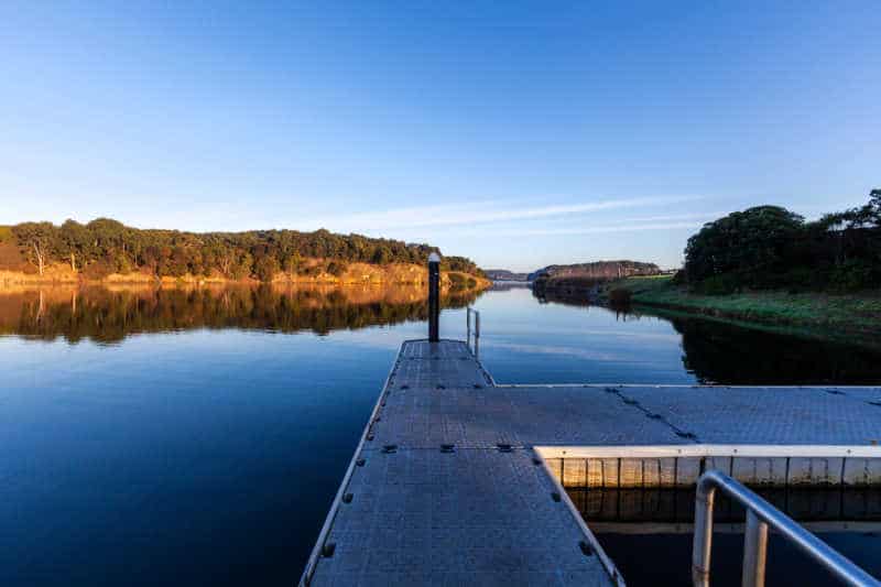 Pier on Hopkins River at sunrise. Allansford, Victoria, Australia