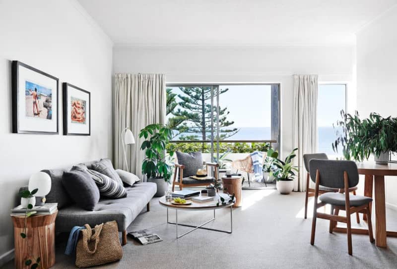 Guest room with balcony and trees at Cumberland Lorne Resort in Victoria.