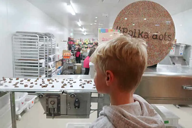 Child watching chocolate being made at the Great Ocean Road Chocolaterie one of the best things to do with kids in Torquay Victoria.