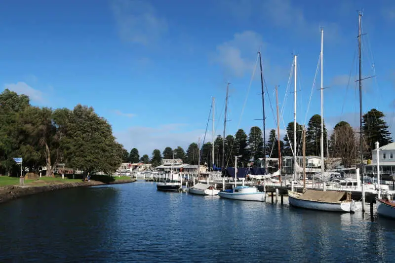 Boats along the river and harbour at Port Fairy in Victoria, Australia.