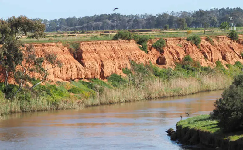Red cliffs alongside the river at K Road in Werribee.