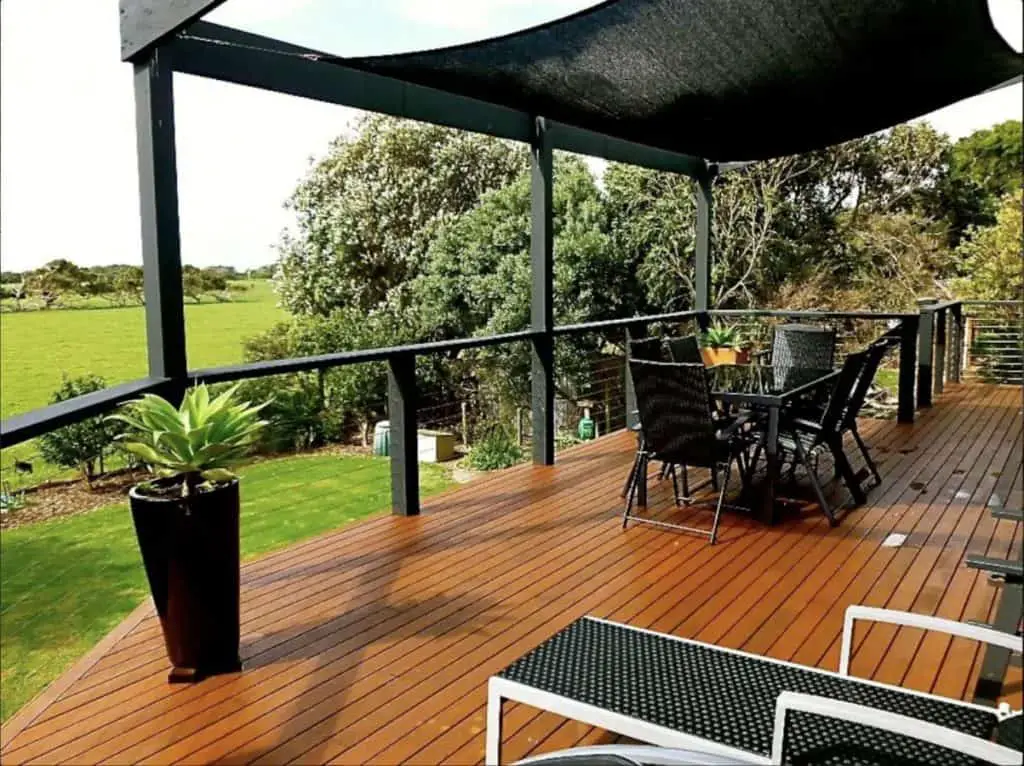 Lush deck area with nature views at Sandy Point Beach House luxury accommodation in Wilsons Prom.