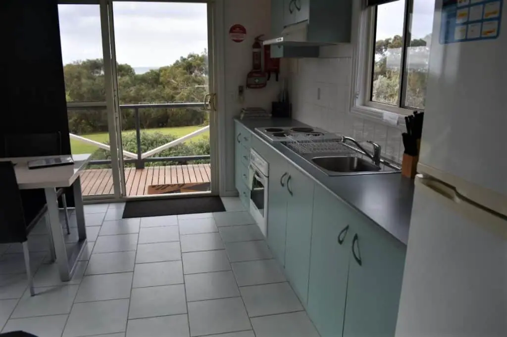 Kitchen with deck view at Tidal Dreaming Seaview Cottages.