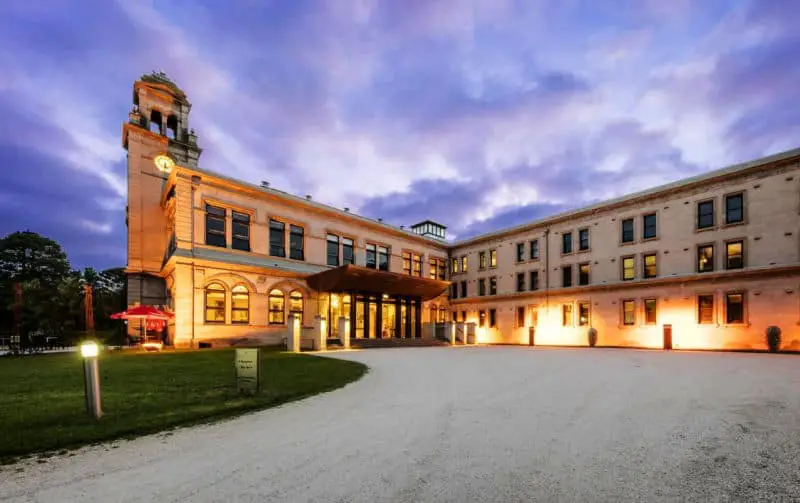 Image of Lancemore Werribee Mansion Hotel at sunset with scenic lighting.