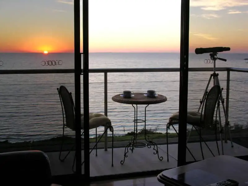 Balcony with sunset views at Clifftop Apartments.