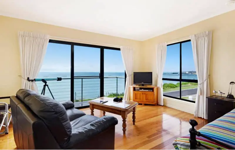 Living area with ocean views at Clifftop Apartments in Portland.