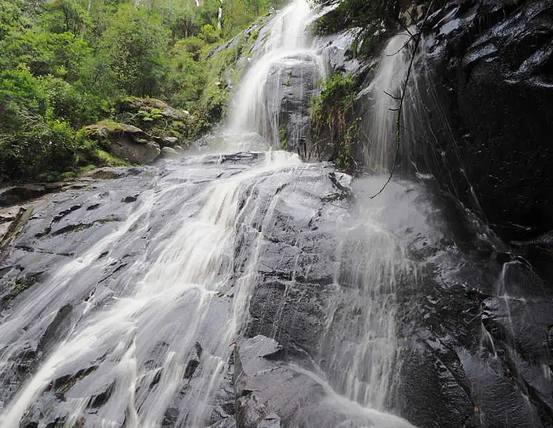 Rushing water over the rocks at Straw Falls in the Otwtays a waterfall in Lorne Victoria.