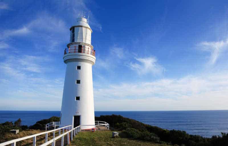 Cape Otway Lightstation on the Great Ocean Road with ocean and deep blue sky. A wonderful Great Ocean Road attraction.