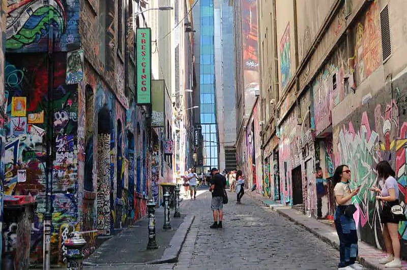 People looking at Melbourne Street Art in Hosier Lane.