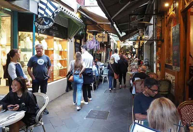 People dining, shopping, and talking in the Melbourne laneways.