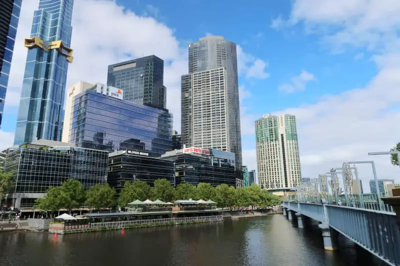 View of of river alfresco dining and tall buildings at Southbank in Melbourne Victoria.