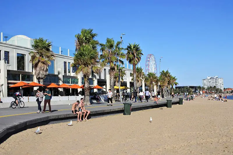 Visitors at St Kilda Beach, a very popular tourist attraction in Melbourne Victoria Australia.