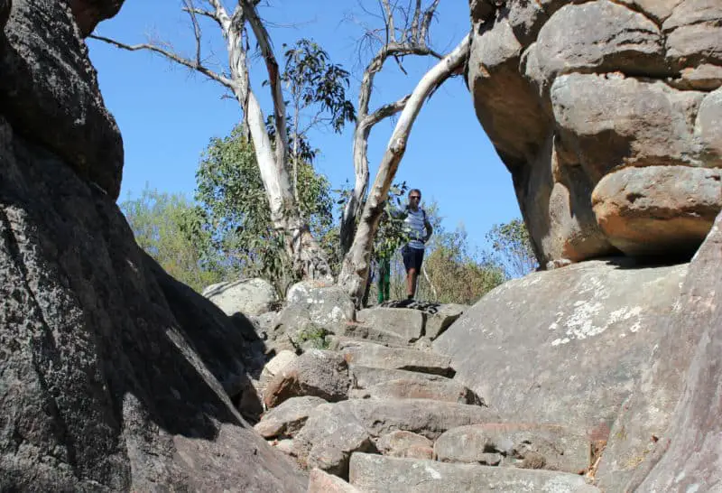 Man standing at the top of a Grampians hiking trail.
