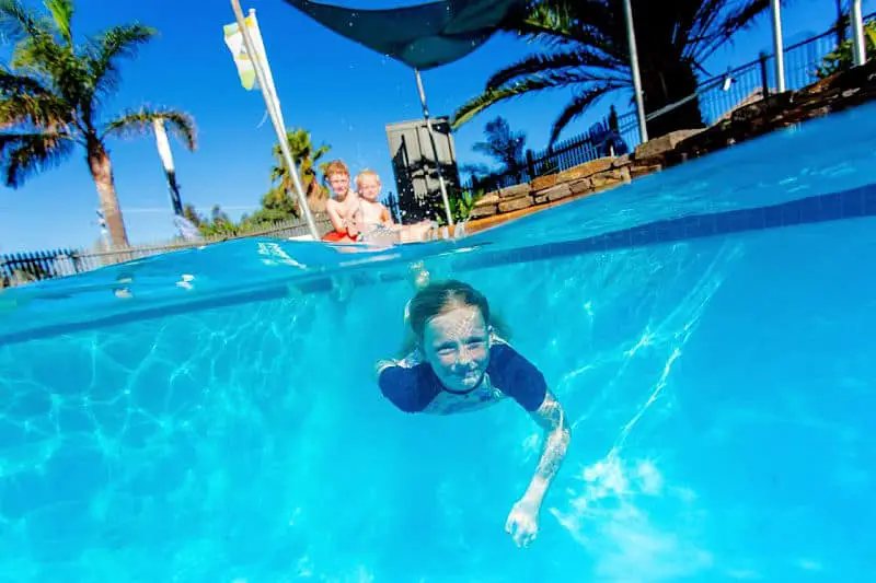 Child swimming under water at Ingenia Holidays Torquay Victoria.