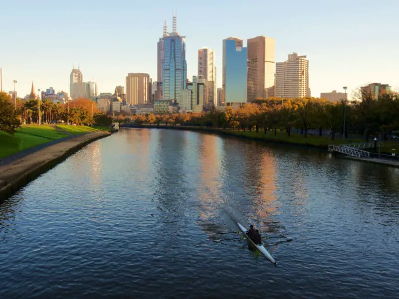 Melbourne with kayak rowers on the Yarra River Sunset Tour. One of the top things to do at the Docklands. 