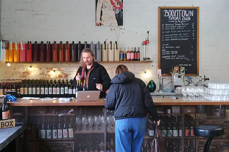 Woman sampling wine at Boom Town Winery in Castlemaine Victoria.