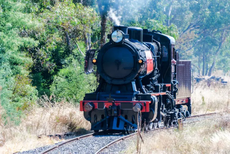 Historic steam train running on Maldon – Castlemaine route in the goldfields of Victoria, Australia.