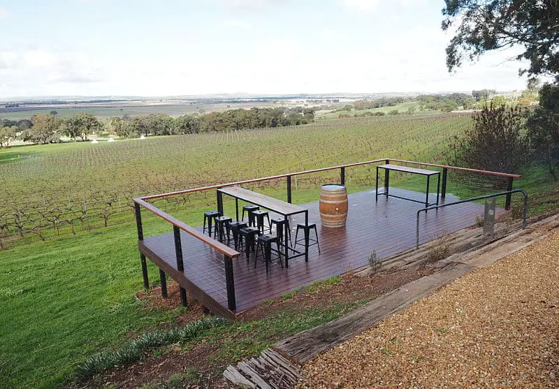 Outdoor seating with tables overlooking the vineyards at Montara Wines one of the popular Ararat Grampians wineries.