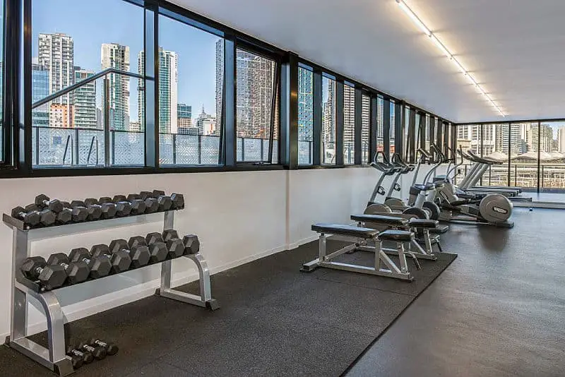 Gym area with city views at Peppers Hotel Docklands.