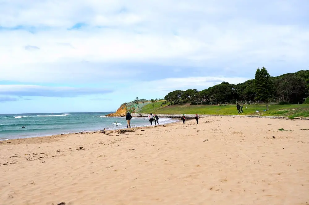 People enjoying the beach at Torquay in Victoria. The first stop on your Great Ocean Road 2 day itinerary.