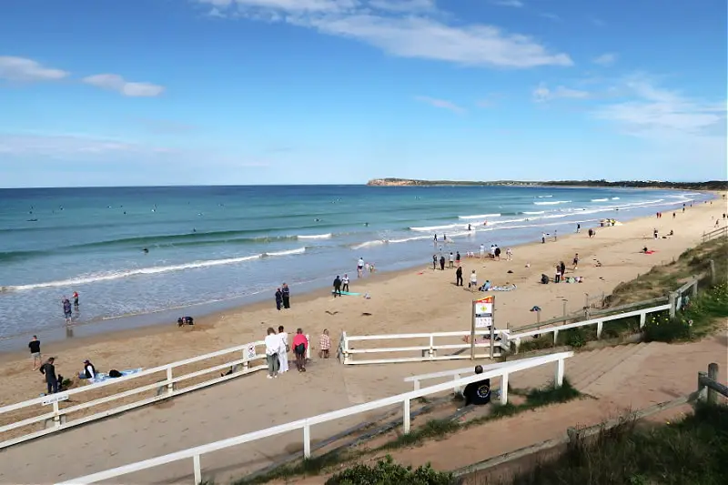 People enjoying a Bellarine Peninsula beach on a bright sunny day.