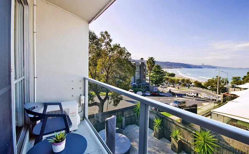 Balcony with sea views and outdoor furniture at  Bay View Motel Lorne.