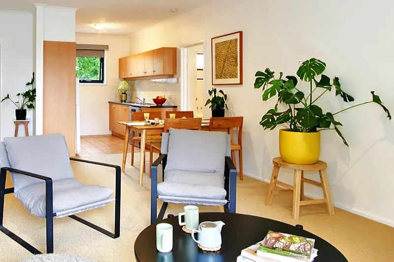 Guest room with lounge and kitchenette at Lorne Surf Apartments holiday accommodation Lorne.