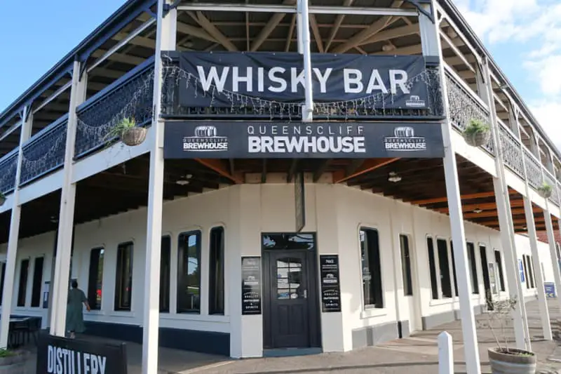 Corner entrance to the Queenscliff Brewhouse with wrap-around verandah and blue skies.