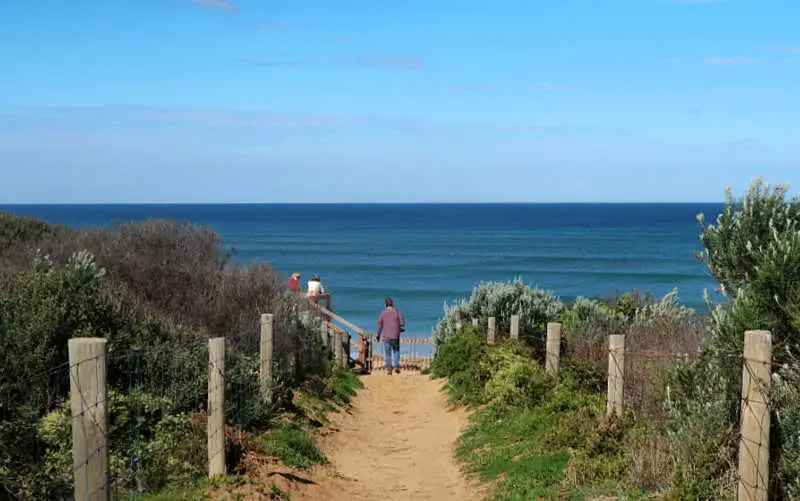 Man walking along a trail at Buckley Park Foreshore Reserve one of the active things to do in Ocean Grove Victoria.