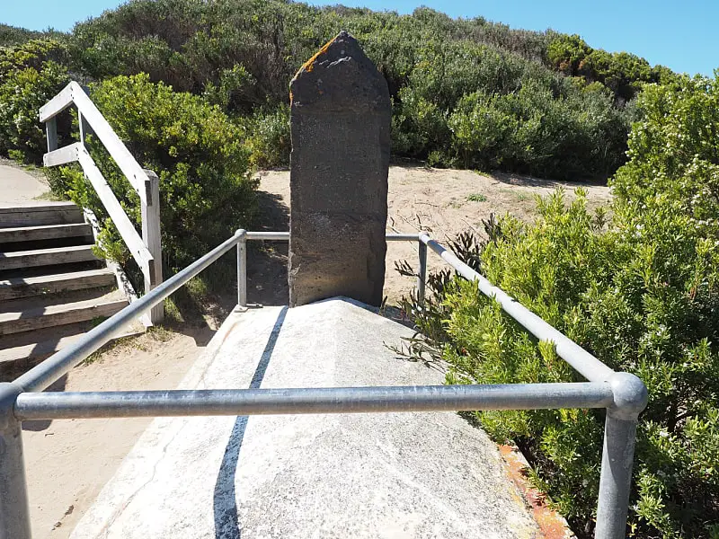 Headstone and grave at surrounded by coastal scrub at Granny's Grave in Warrnambool. 