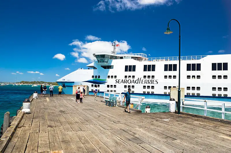 View of the Searoad Ferry with passengers on the Queenscliff ferry dock on a sunny day