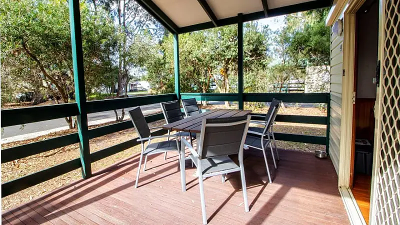 Bellarine Bayside Portarlington cabin covered decked area with outdoor setting. 