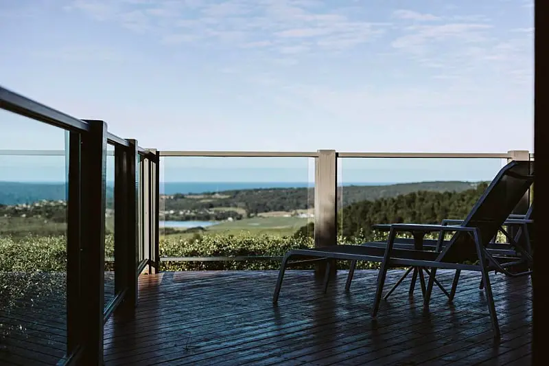 Balcony with ocean views and sun lounge at Point of View Villas luxury accommodation in Apollo Bay.