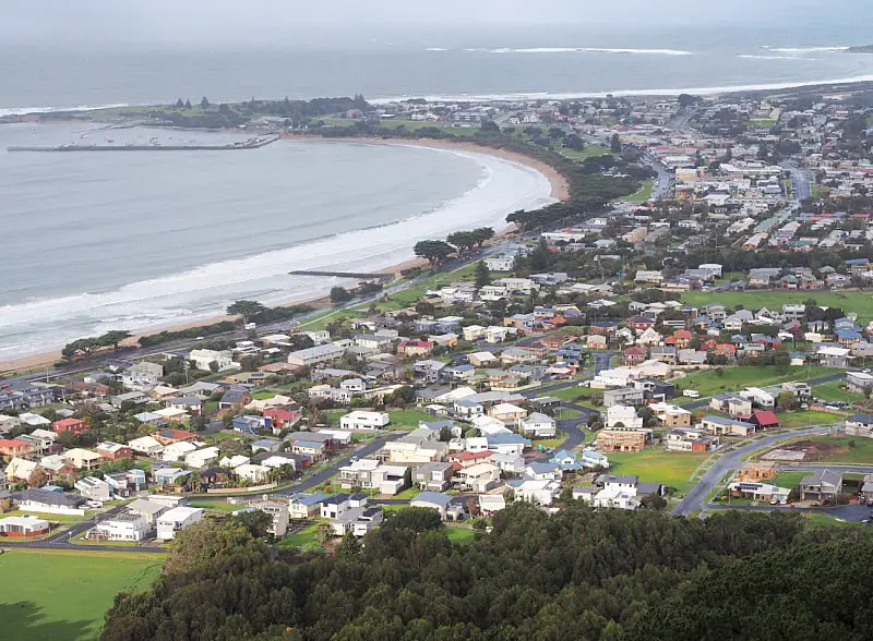 View of Apollo Bay and sea from Marriner's Lookout on a dull day. The town is a popular stop along the Great Ocean Road and there are plenty of Apollo Bay accommodation options to choose from.